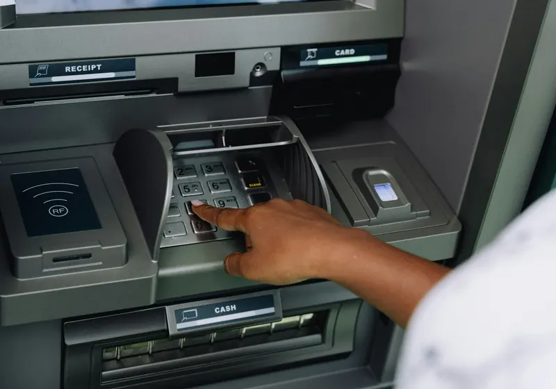 A person using a cash machine
