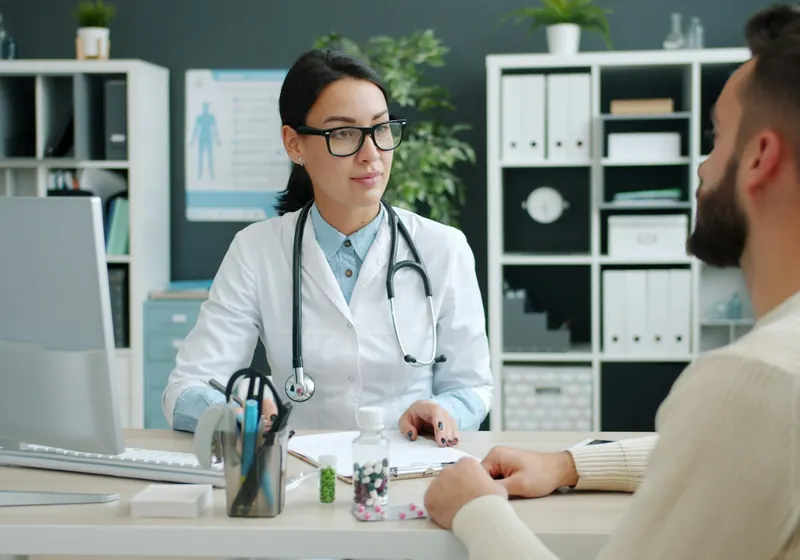 A doctor talking with a patient